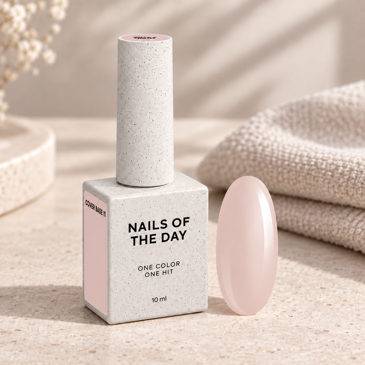 Cover Base 11 Nails Of The Day apresentada num ambiente profissional de manicure